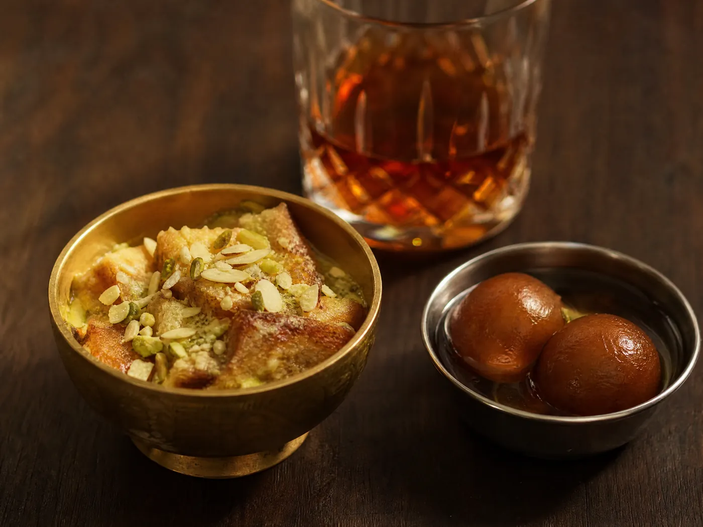 Double ka meetha and gulab jamun with a glass of dark rum.